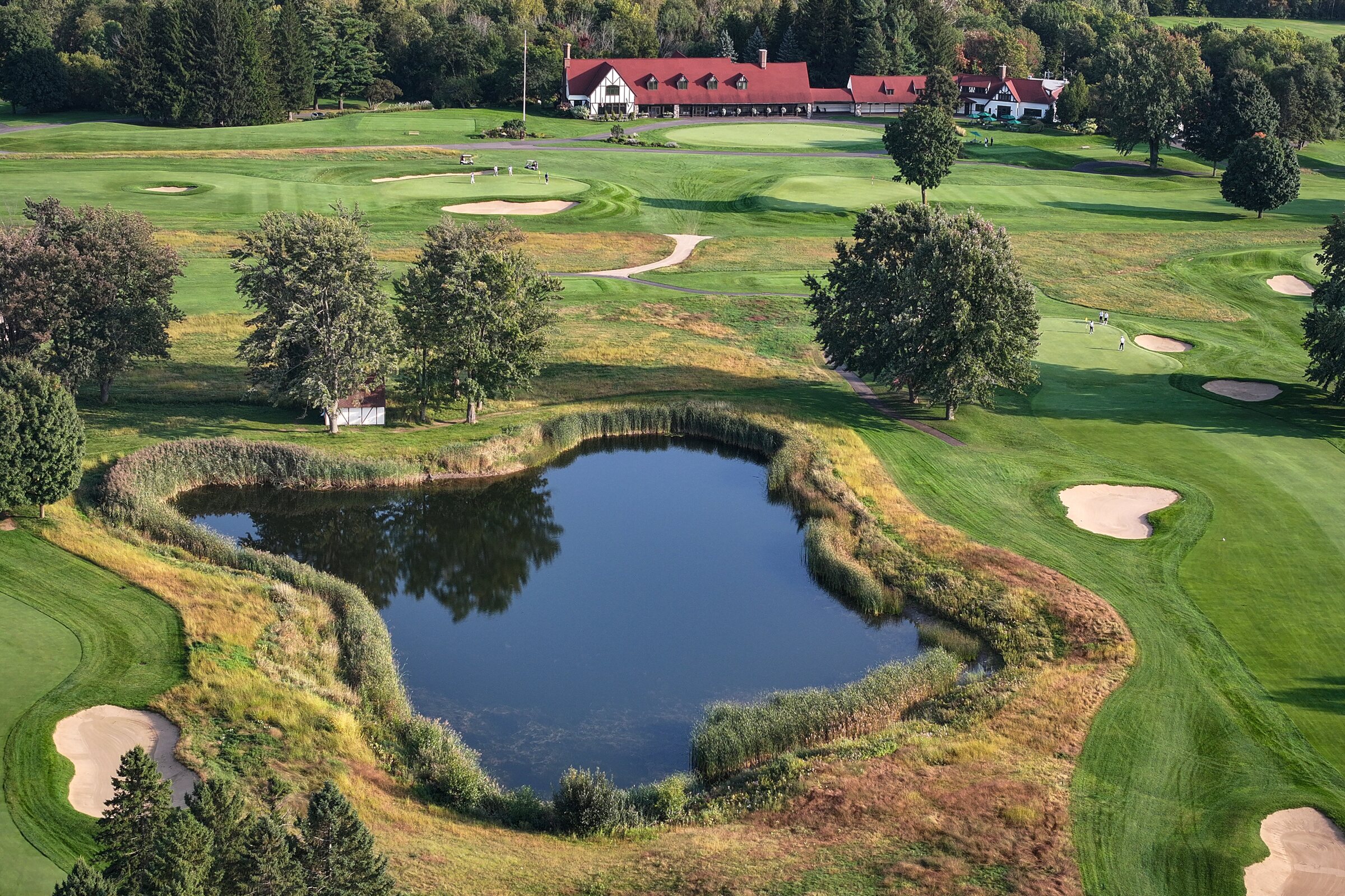 Golf course pond and clubhouse at Mount Bruno Country Club