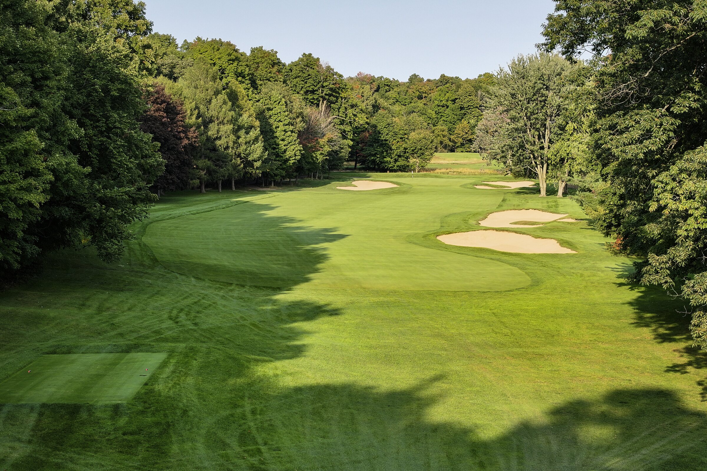 Fairway framed by trees at Mount Bruno Country Club
